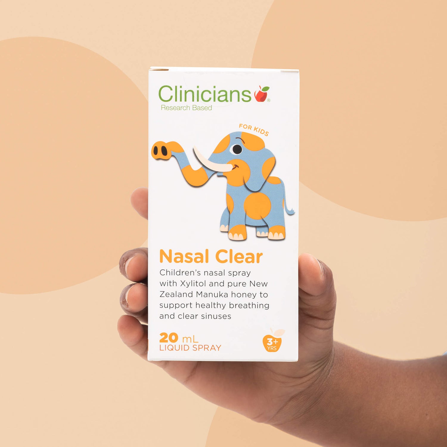 Child's hand holding a box of Clinicians Nasal Clear