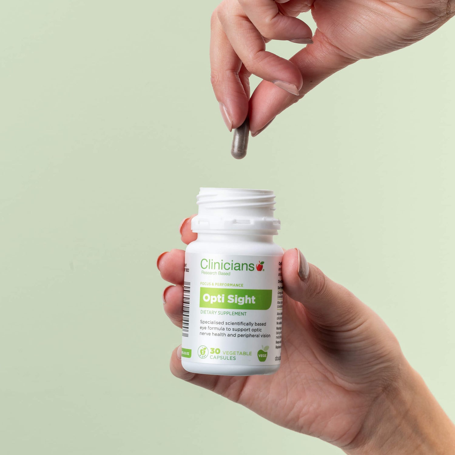 Hand dropping in capsule to product packaging