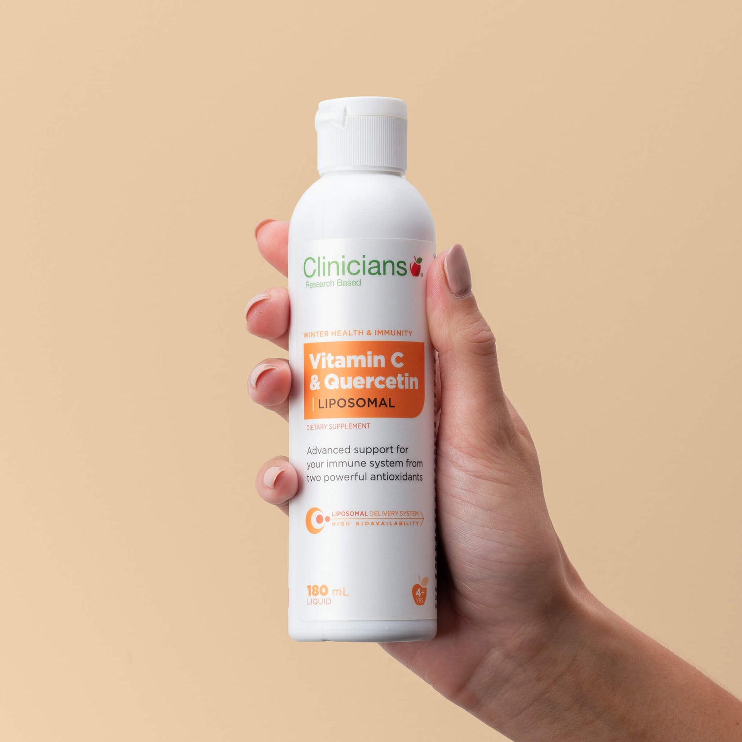 Hand holding liquid form of product packaging